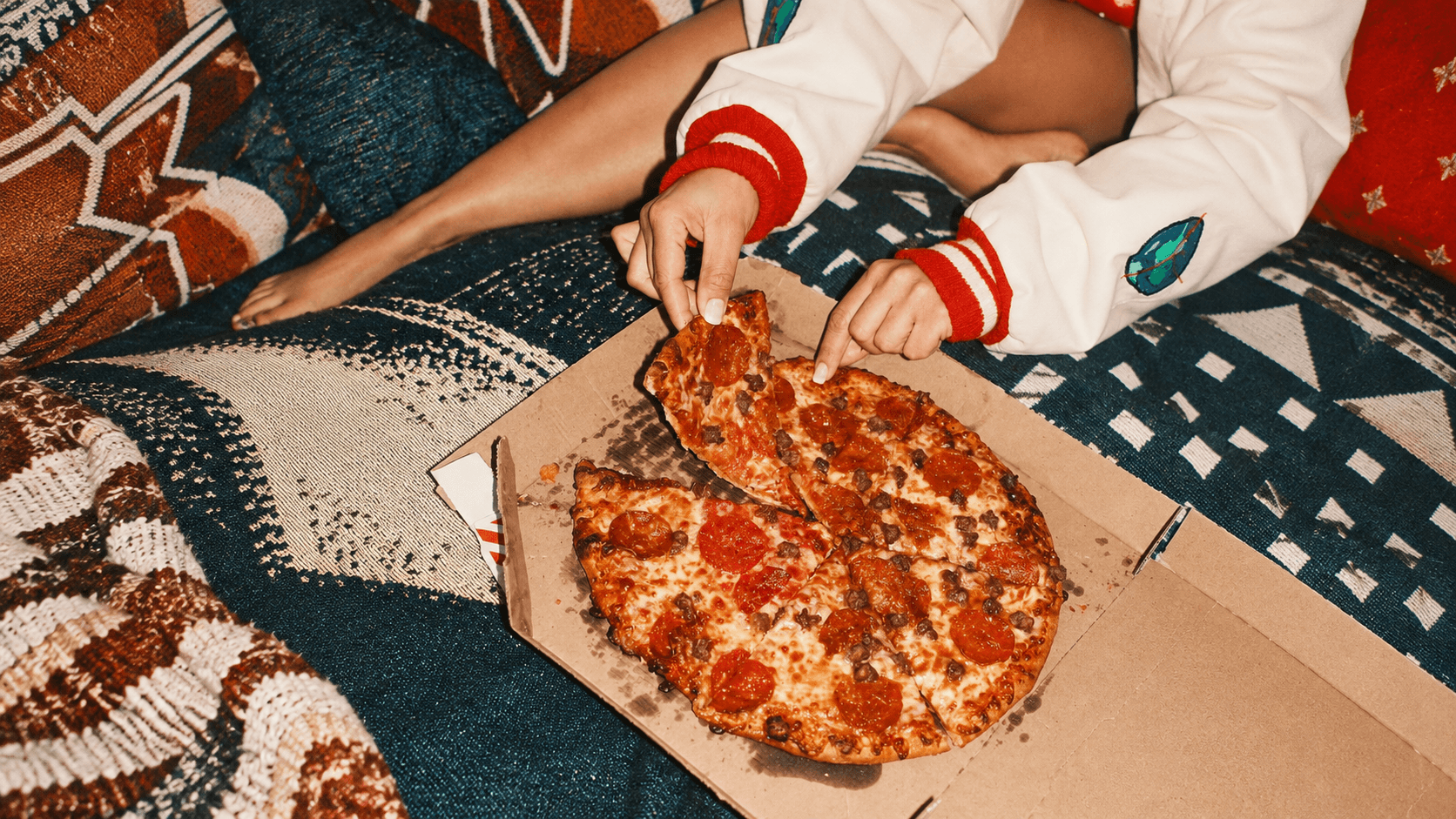 Friends sharing food during an evening experience.