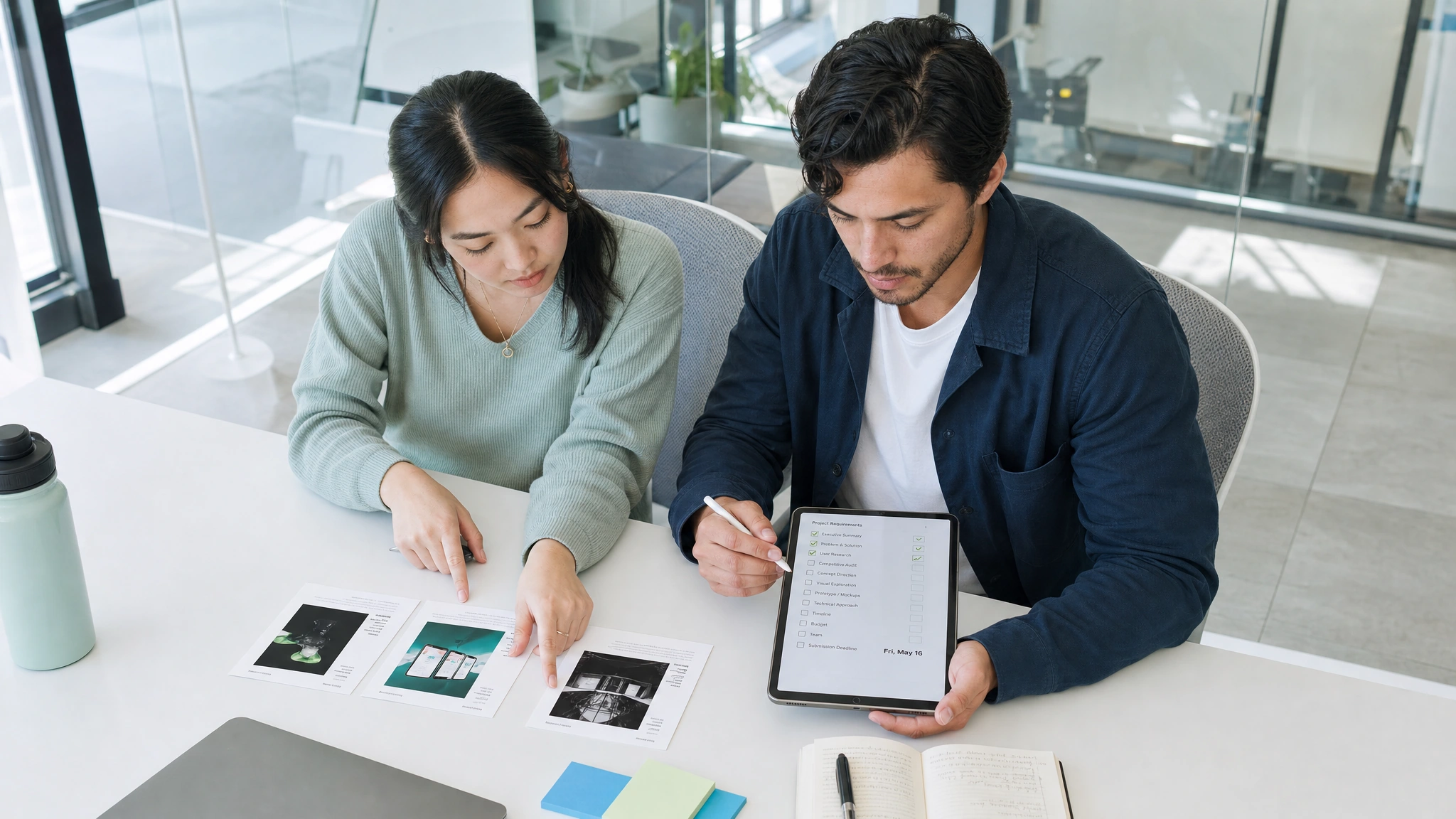Two teammates compare specialist portfolios against their project requirements.